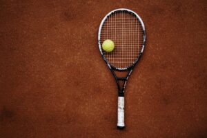 a tennis racket and a tennis ball
